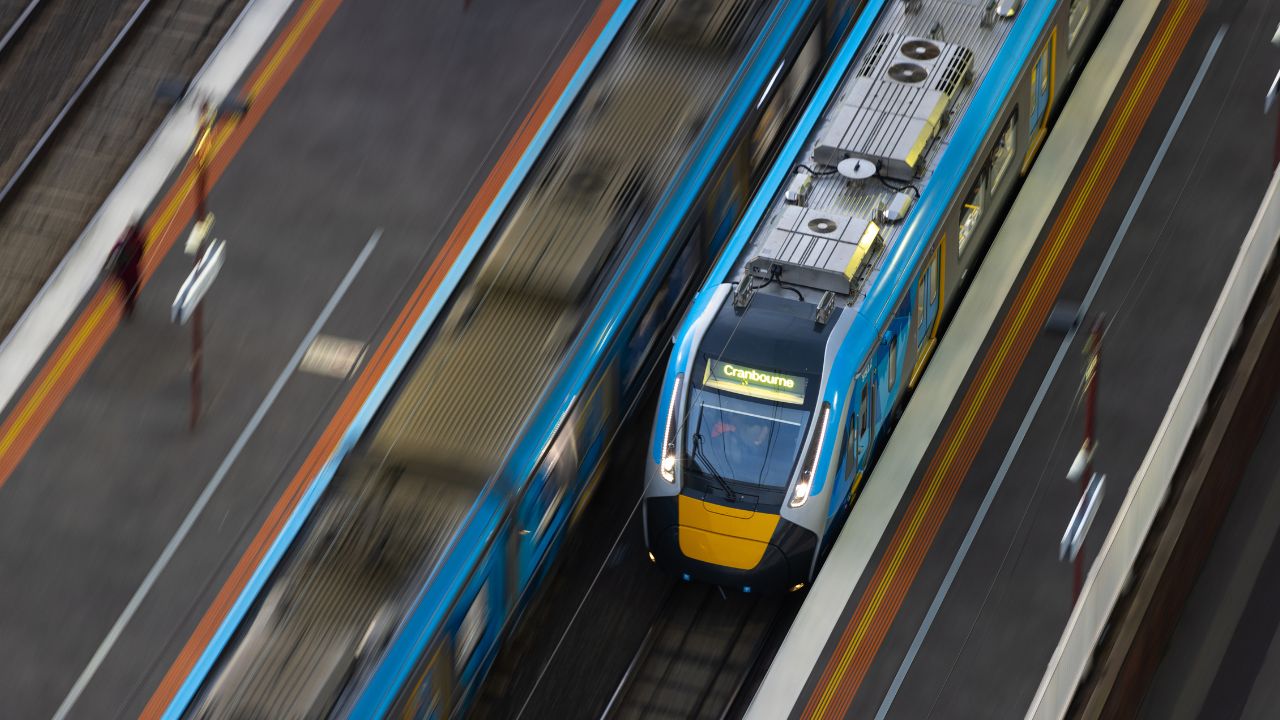 Metro train travelling through a train station